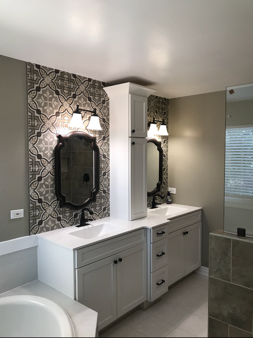 Master bathroom remodel in Lake County featuring Rose Hill Cabinets vanity, patterned tile feature wall, and custom glass shower