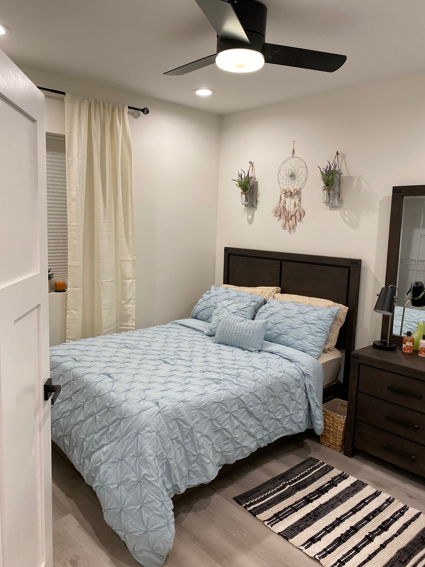 Basement spare bedroom featuring Mannington luxury vinyl plank flooring, showcasing durable, moisture-resistant flooring ideal for finished basement living spaces