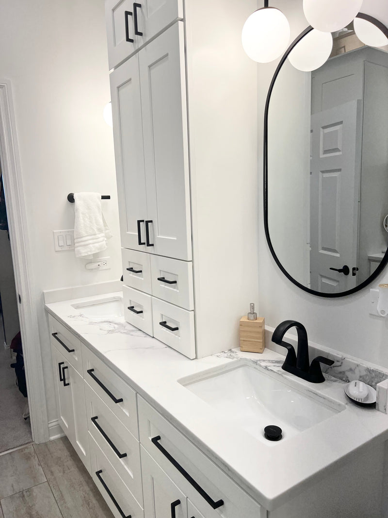 Modern bathroom vanity with Rose Hill white shaker cabinets, black plumbing fixtures, quartz countertop, and clean contemporary finishes.