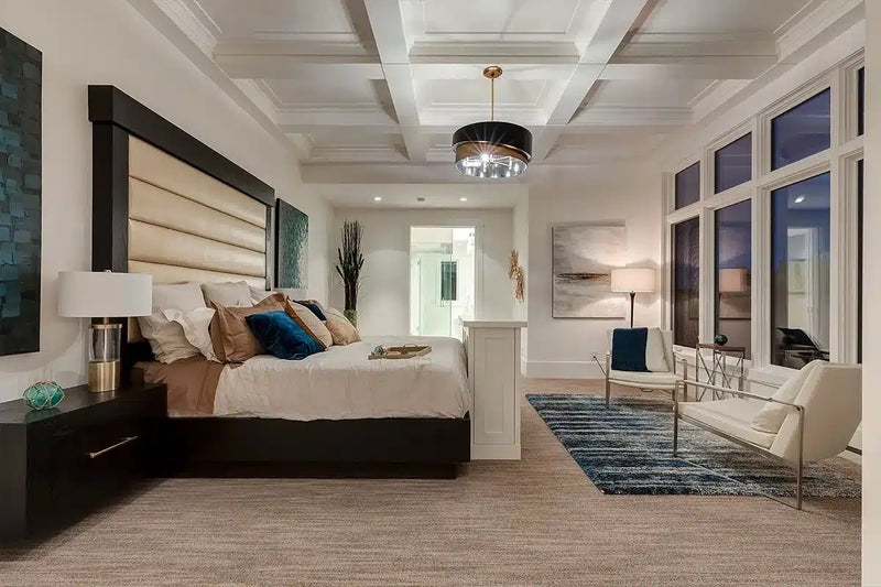 Primary bedroom addition with coffered ceiling, accent wall, and ensuite bathroom opening