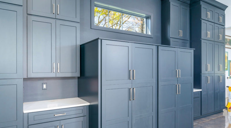 Rose Hill Cabinets blue shaker floor-to-ceiling pantry and wall cabinets with brushed nickel hardware and built-in desk nook