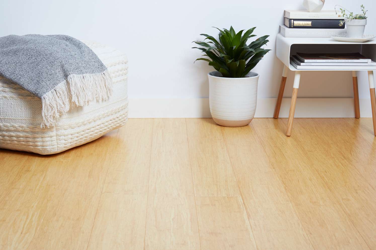 Close-up of light natural hardwood flooring in a bright minimalist living space