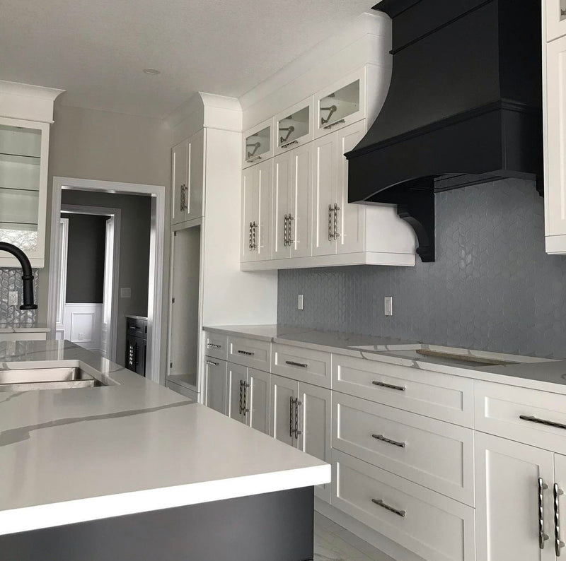 White Rose Hill Cabinets kitchen featuring a custom black wood hood, quartz countertops, MSI tile backsplash, and matte black fixtures in a high-end transitional kitchen design