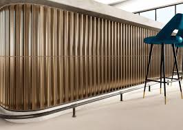 Brushed bronze metal fluted tile accent wall