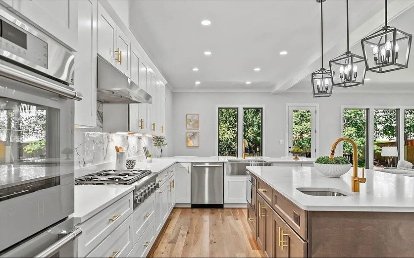 Era Shaker Walnut range wall detail, white uppers, walnut island — Lotus Home Improvement install