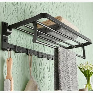 Matte black wall-mounted towel rack with shelf and hooks