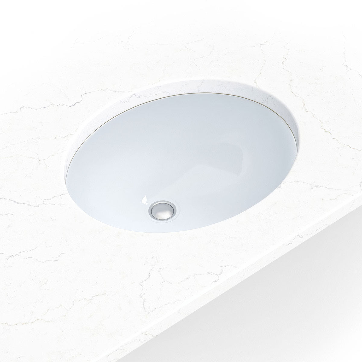 Compact white porcelain oval undermount vanity sink shown in a bathroom scene