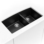 MSI quartz composite 60/40 double-bowl kitchen sink in black in a kitchen setting