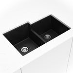 Matte black quartz 60/40 double-bowl kitchen sink shown in a kitchen scene