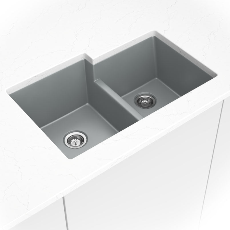 Matte gray quartz 60/40 double-bowl kitchen sink shown in a kitchen scene
