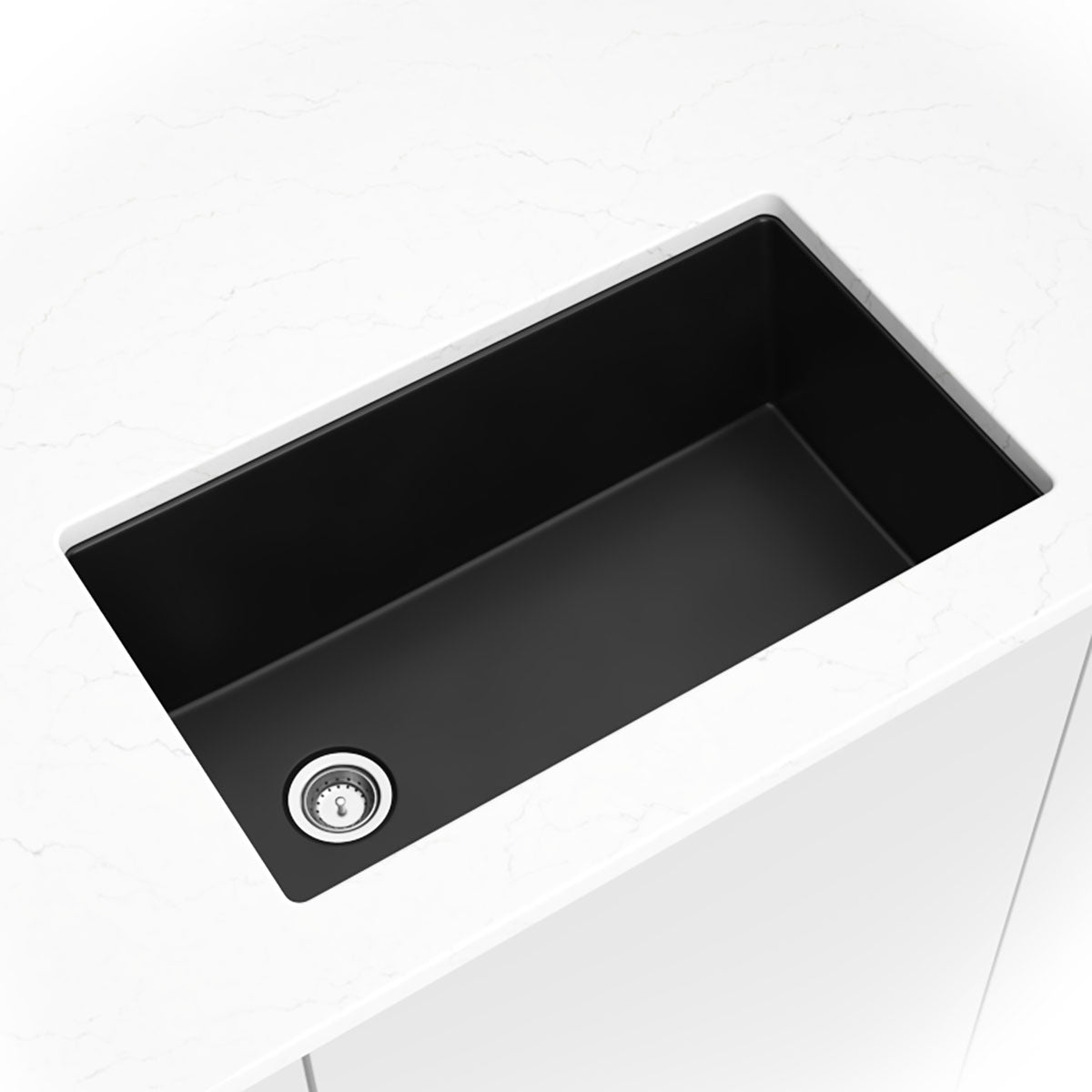 Matte black quartz single-bowl kitchen sink shown in a kitchen scene