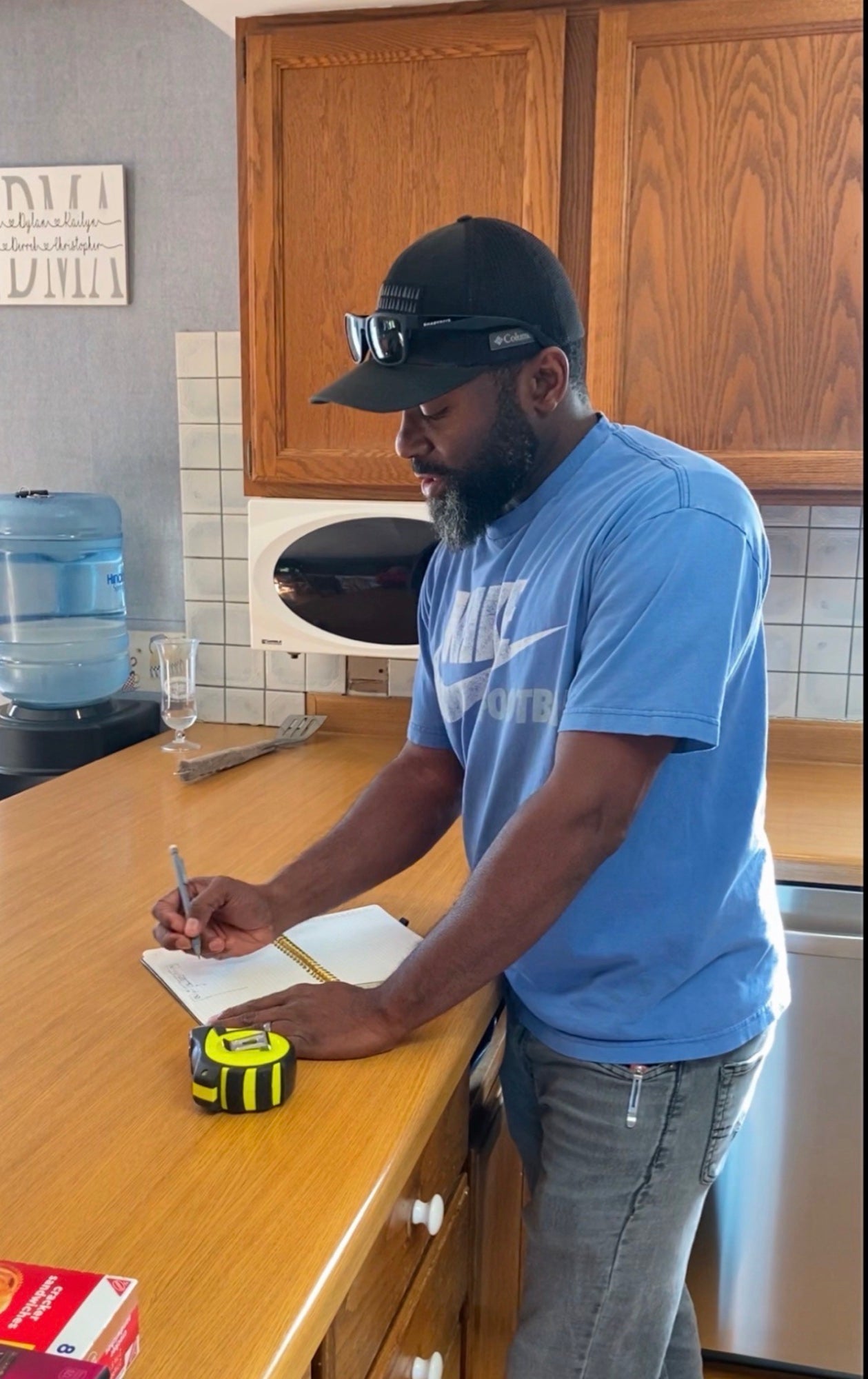 Marcus measuring at a remodeling project