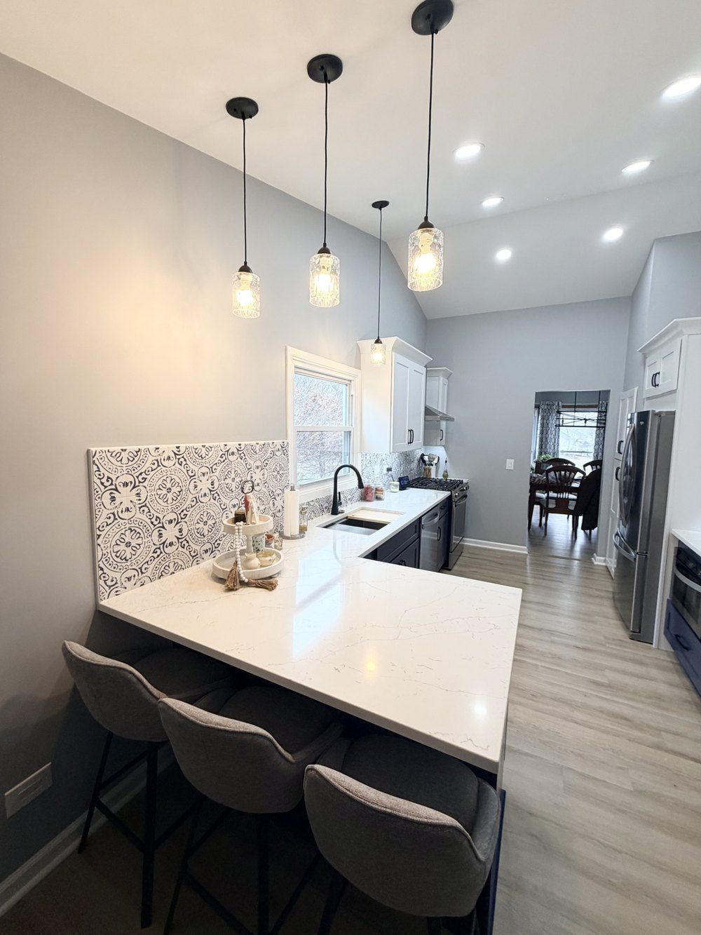 Navy and white Rose Hill cabinets in a completed kitchen